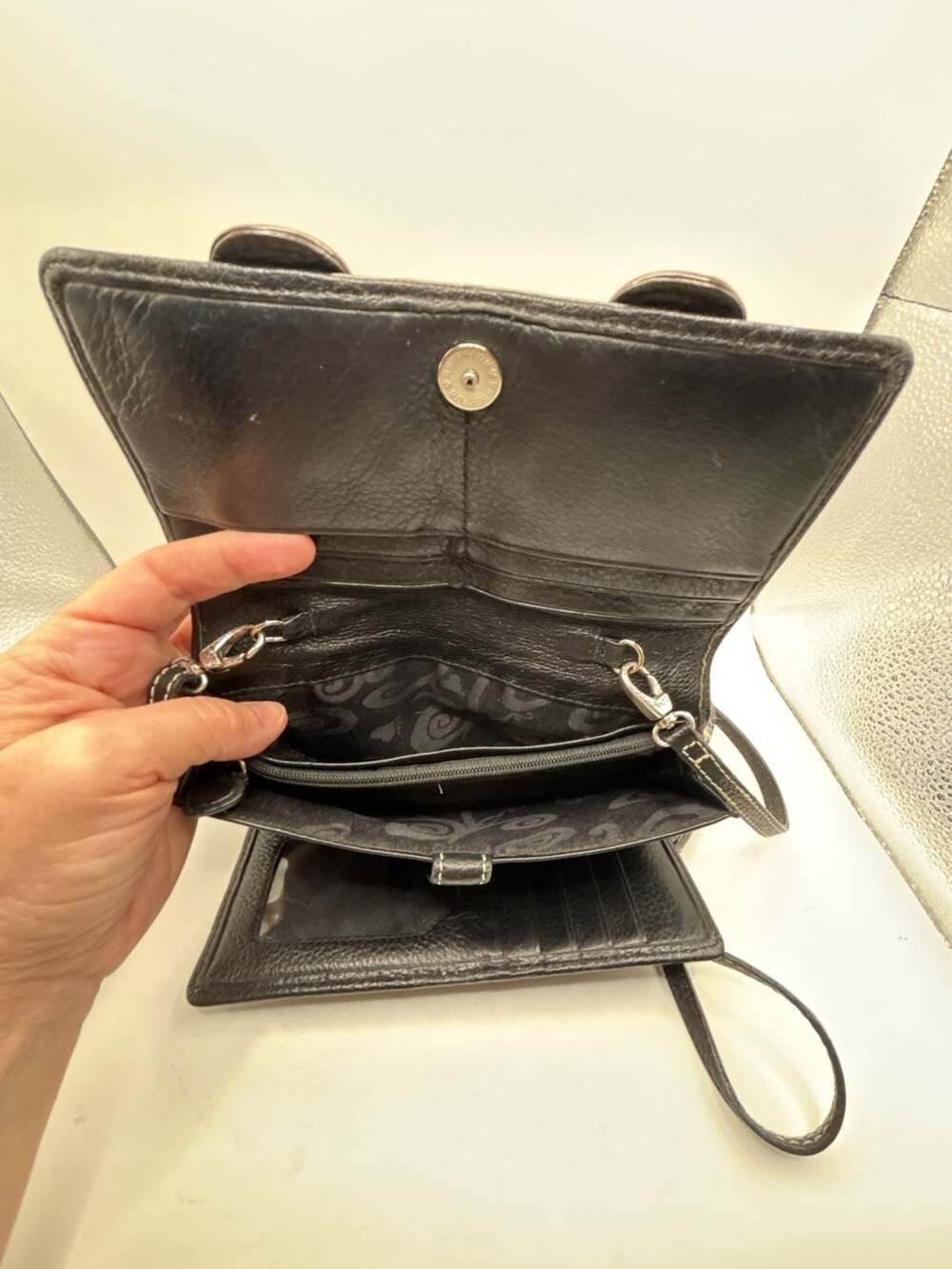 Brighton Black Pebbled Leather Organizer Wallet with Buckle Accents and Strap - Picture 4 of 7